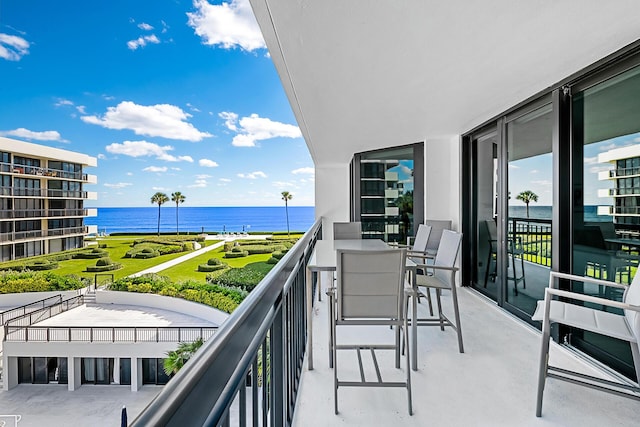 balcony featuring a water view