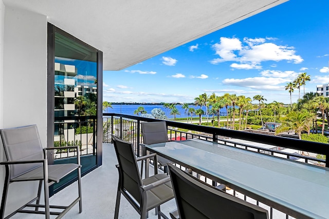 balcony featuring a water view