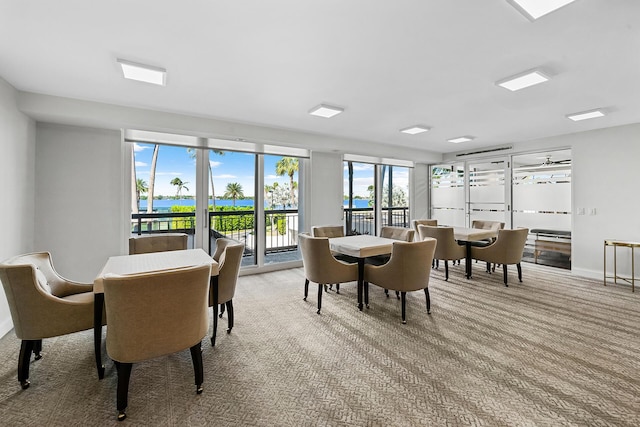 dining space with light colored carpet