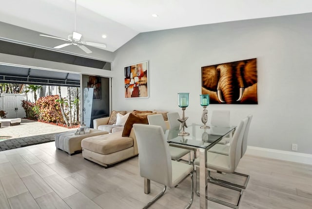 dining room featuring vaulted ceiling, ceiling fan, and light wood-type flooring