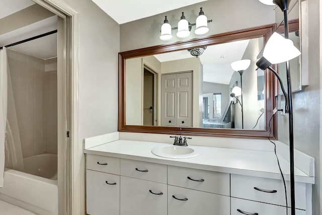 bathroom featuring vanity and shower / tub combo