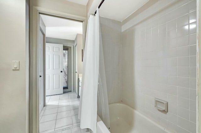 bathroom featuring shower / tub combo and tile patterned flooring