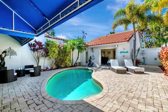 view of swimming pool featuring a patio area