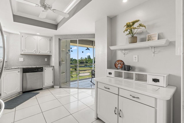 kitchen with ornamental molding, open shelves, stainless steel dishwasher, white cabinetry, and a raised ceiling