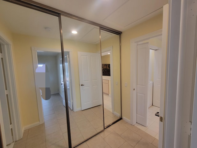 hall with light tile patterned flooring