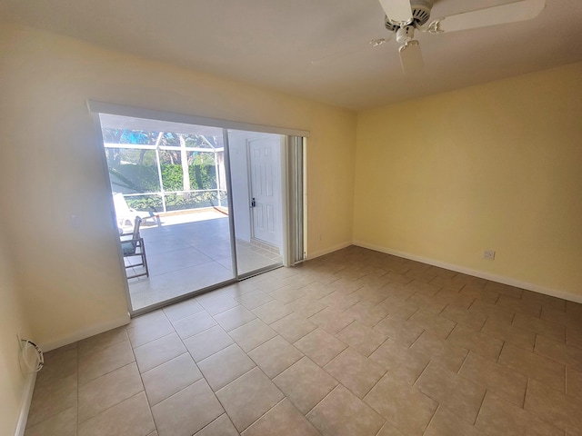 unfurnished room featuring light tile patterned floors and ceiling fan