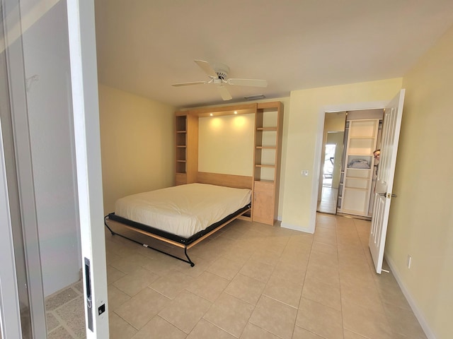 bedroom featuring ceiling fan and light tile patterned flooring