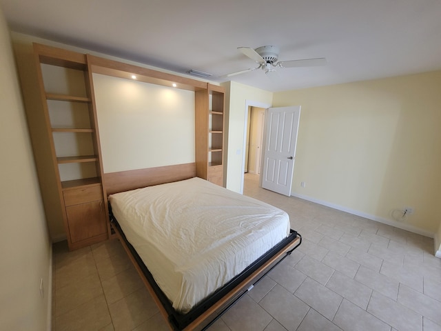 tiled bedroom featuring ceiling fan