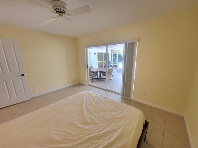 unfurnished bedroom with access to exterior, tile patterned floors, and ceiling fan