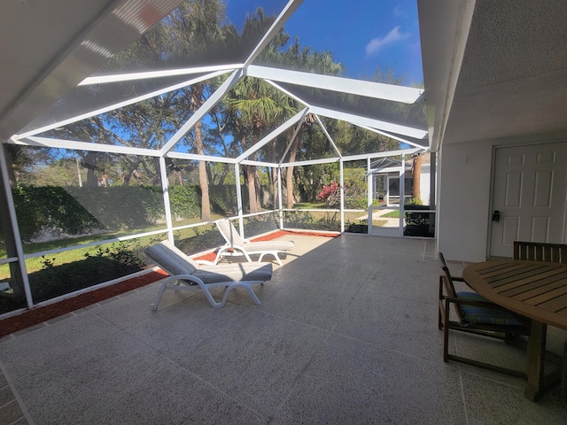 view of patio with a lanai