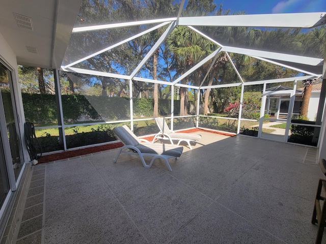 unfurnished sunroom with vaulted ceiling