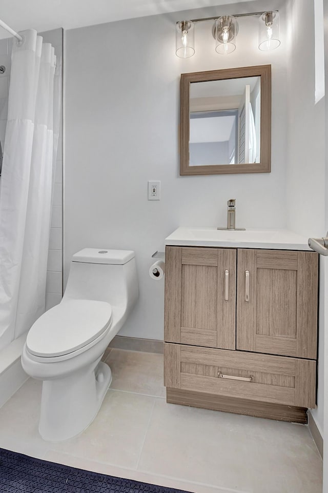 bathroom featuring tile patterned flooring, vanity, a shower with curtain, and toilet