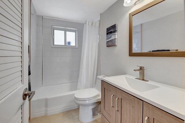 bathroom with toilet, tile patterned floors, shower / bath combo, and vanity