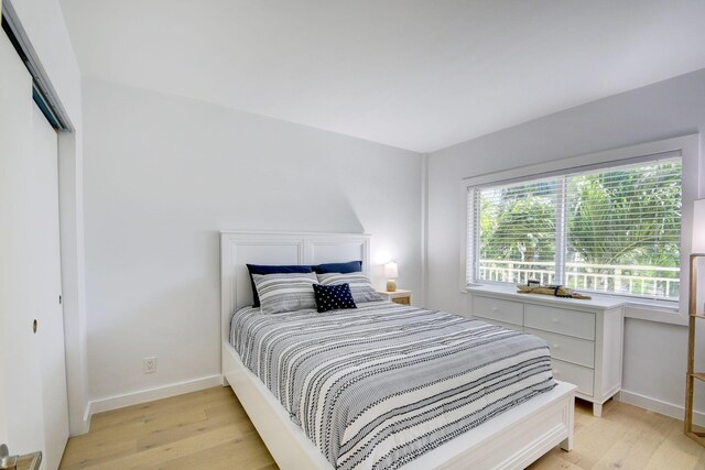 bedroom with light hardwood / wood-style flooring