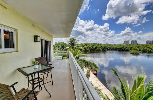 balcony featuring a water view