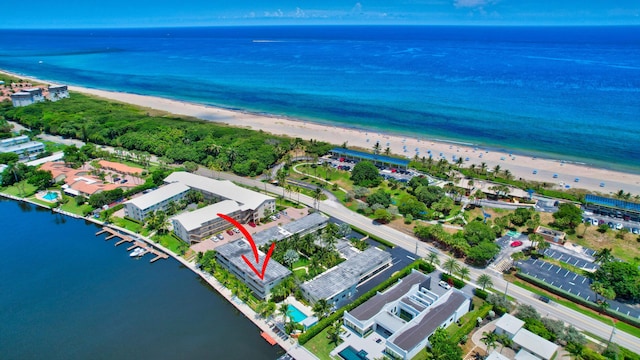 drone / aerial view with a view of the beach and a water view