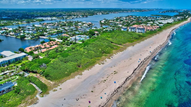 aerial view featuring a water view and a view of the beach