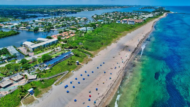 aerial view with a beach view and a water view