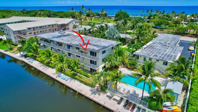 birds eye view of property with a water view