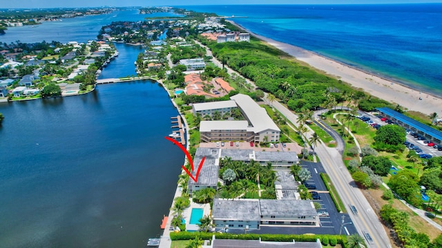 aerial view featuring a water view and a beach view