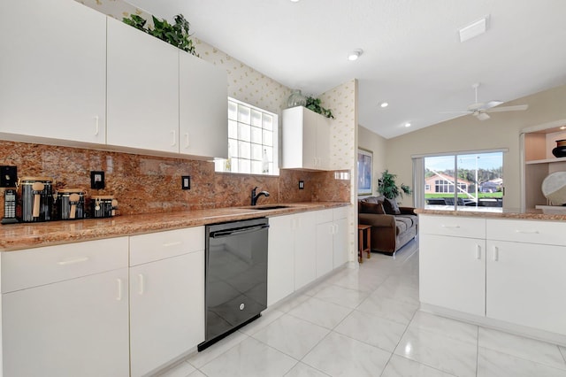 kitchen featuring white cabinetry, a wealth of natural light, dishwasher, and vaulted ceiling