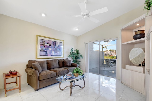 living room with ceiling fan, vaulted ceiling, and light tile patterned floors