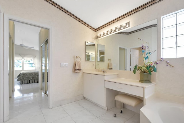 bathroom featuring vanity, a washtub, ornamental molding, and ceiling fan