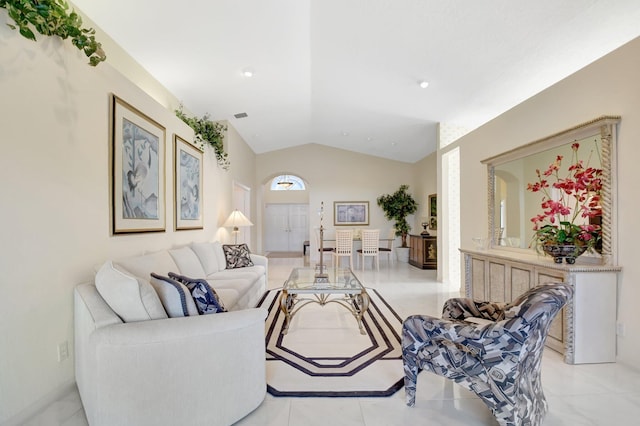 living room featuring lofted ceiling