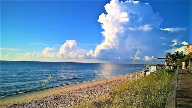 property view of water featuring a beach view