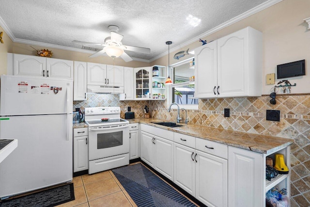 kitchen with sink, white appliances, and white cabinets