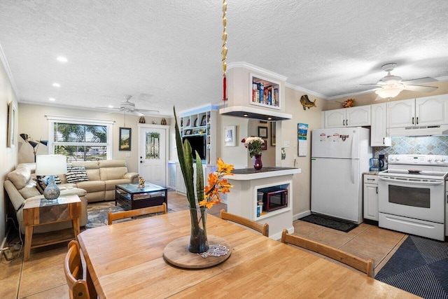 interior space with light tile patterned floors, crown molding, a textured ceiling, and ceiling fan