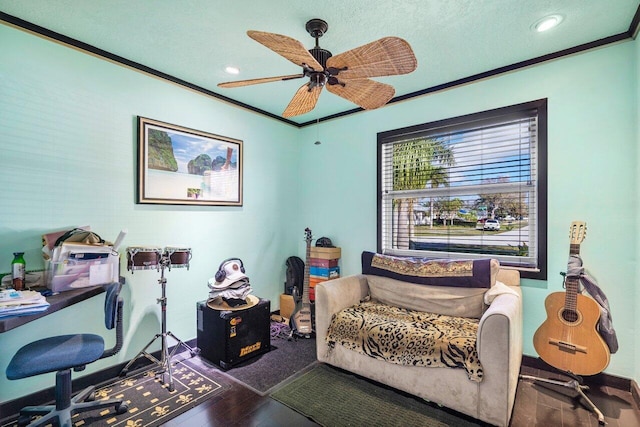 office area featuring ceiling fan, ornamental molding, and dark hardwood / wood-style floors