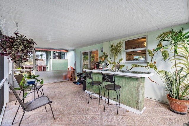 view of patio with an outdoor bar