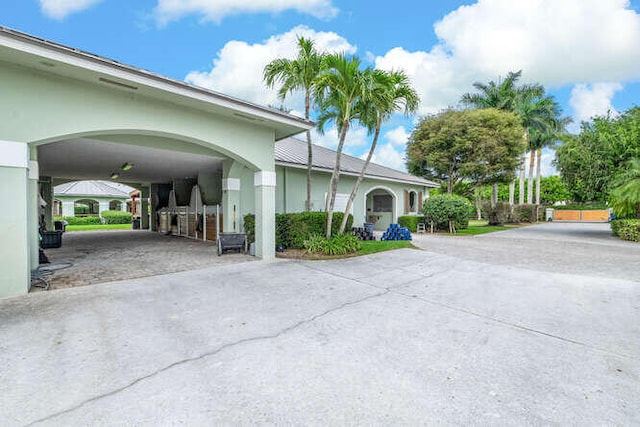 exterior space with concrete driveway