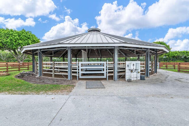 view of community featuring an outbuilding and an exterior structure