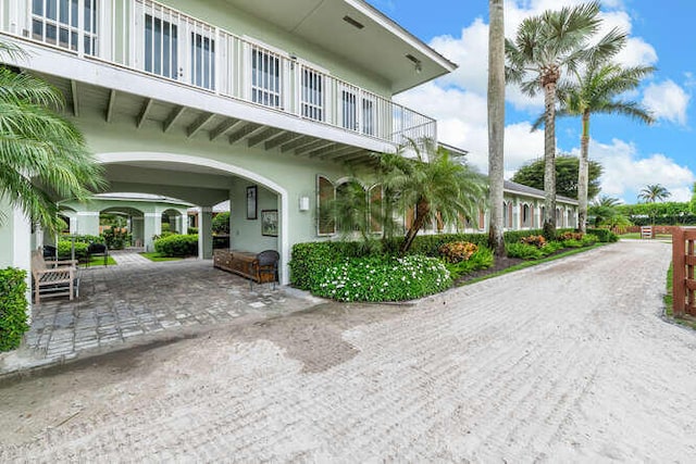 exterior space featuring decorative driveway