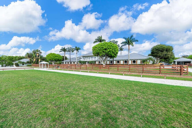 view of yard featuring fence and a gazebo