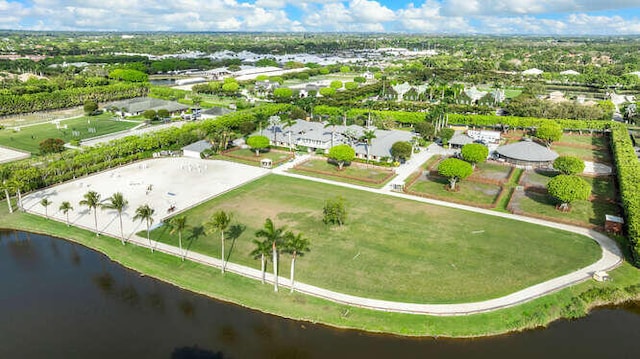 birds eye view of property with a water view and a residential view