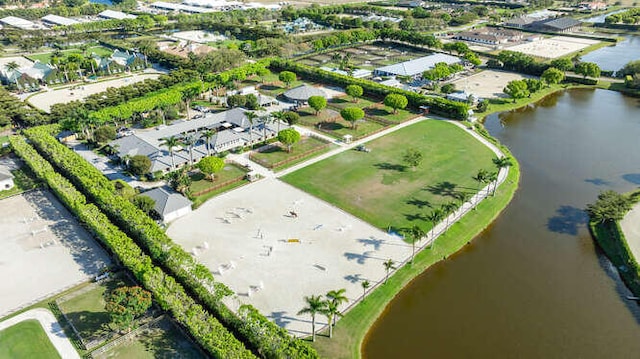 drone / aerial view with a water view and a residential view