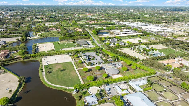 drone / aerial view featuring a water view and a residential view