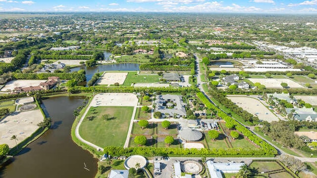 drone / aerial view featuring a water view and a residential view