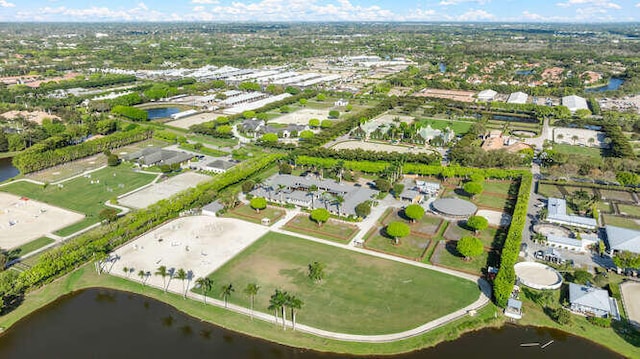 drone / aerial view with a water view and a residential view