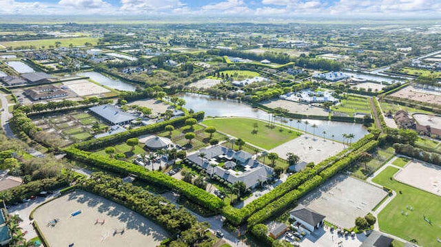 drone / aerial view featuring a residential view and a water view