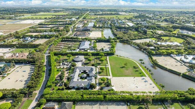 drone / aerial view featuring a water view and a residential view