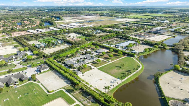 birds eye view of property featuring a water view and a residential view