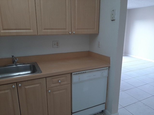 kitchen with dishwasher, sink, and light brown cabinets