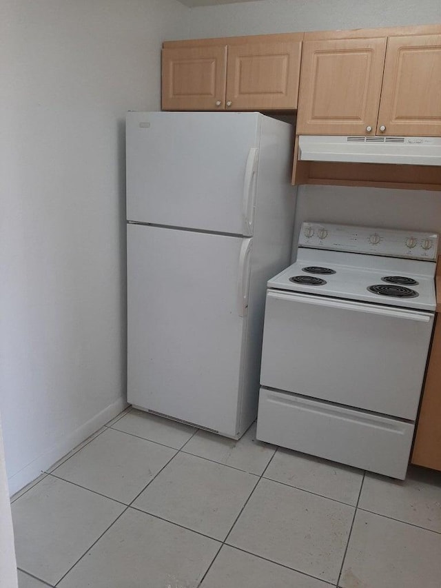 kitchen with light brown cabinets, white appliances, and light tile patterned floors