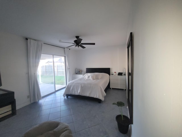 tiled bedroom featuring ceiling fan and access to outside