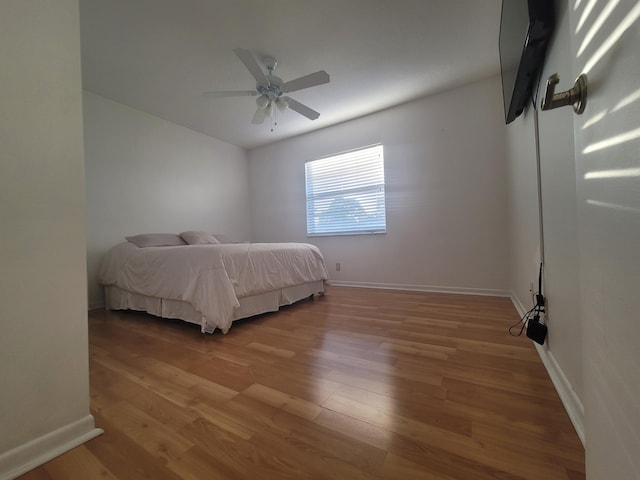 bedroom featuring ceiling fan and hardwood / wood-style floors