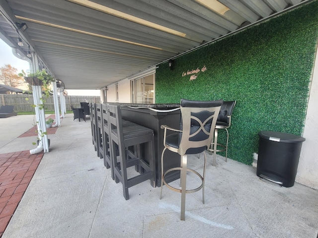 view of patio / terrace featuring an outdoor bar